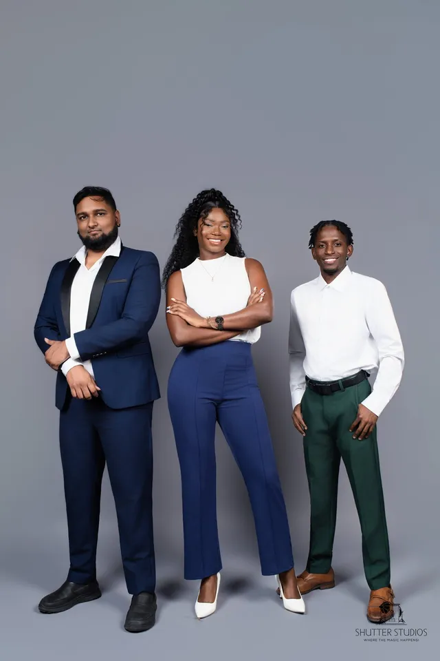 Three OSS staffing team professionals standing together in a studio portrait, Georgetown, Guyana