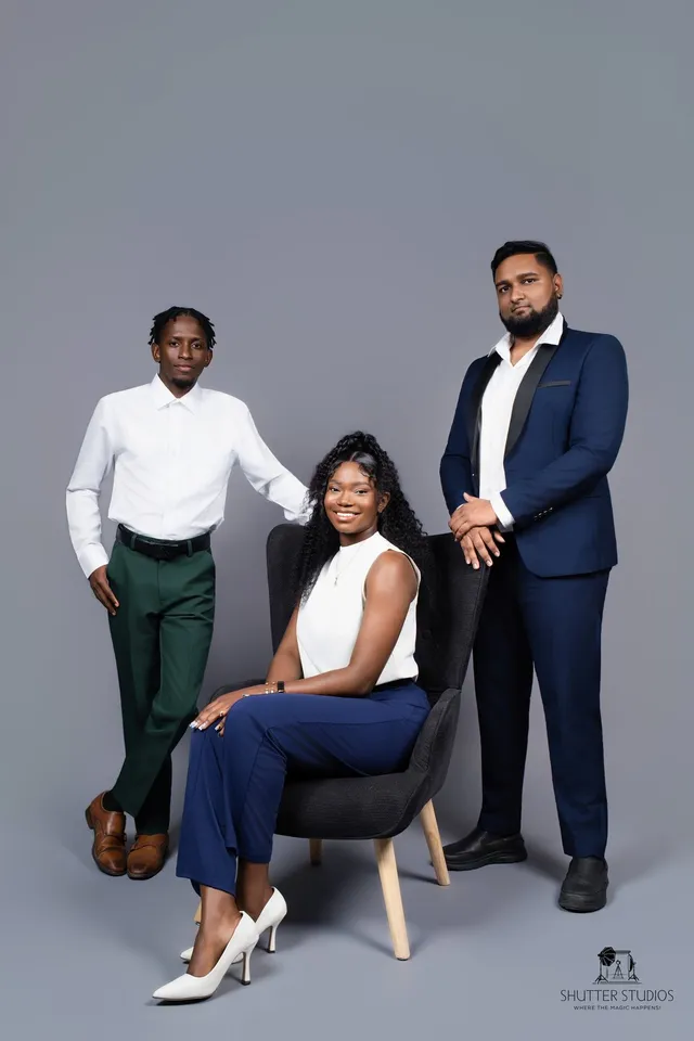 Three OSS staffing team members in a studio portrait, Georgetown, Guyana