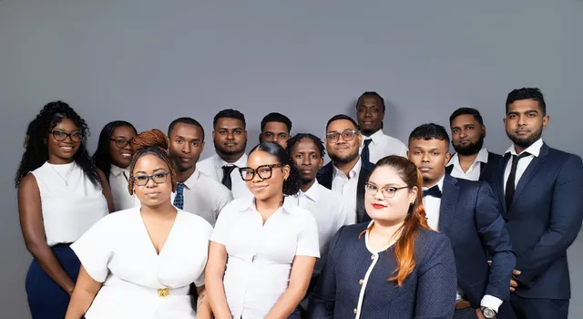 Wide group studio portrait of the OSS staffing team, Georgetown, Guyana
